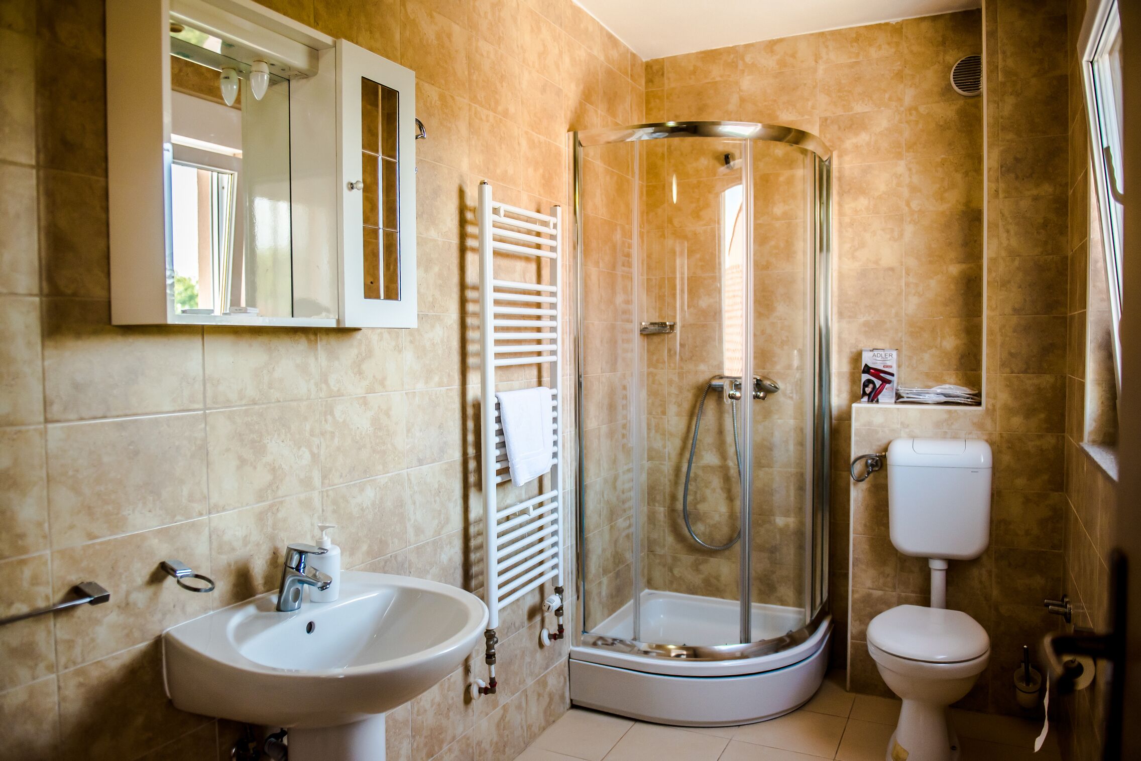 Shower, free toiletries, hair dryer, slippers