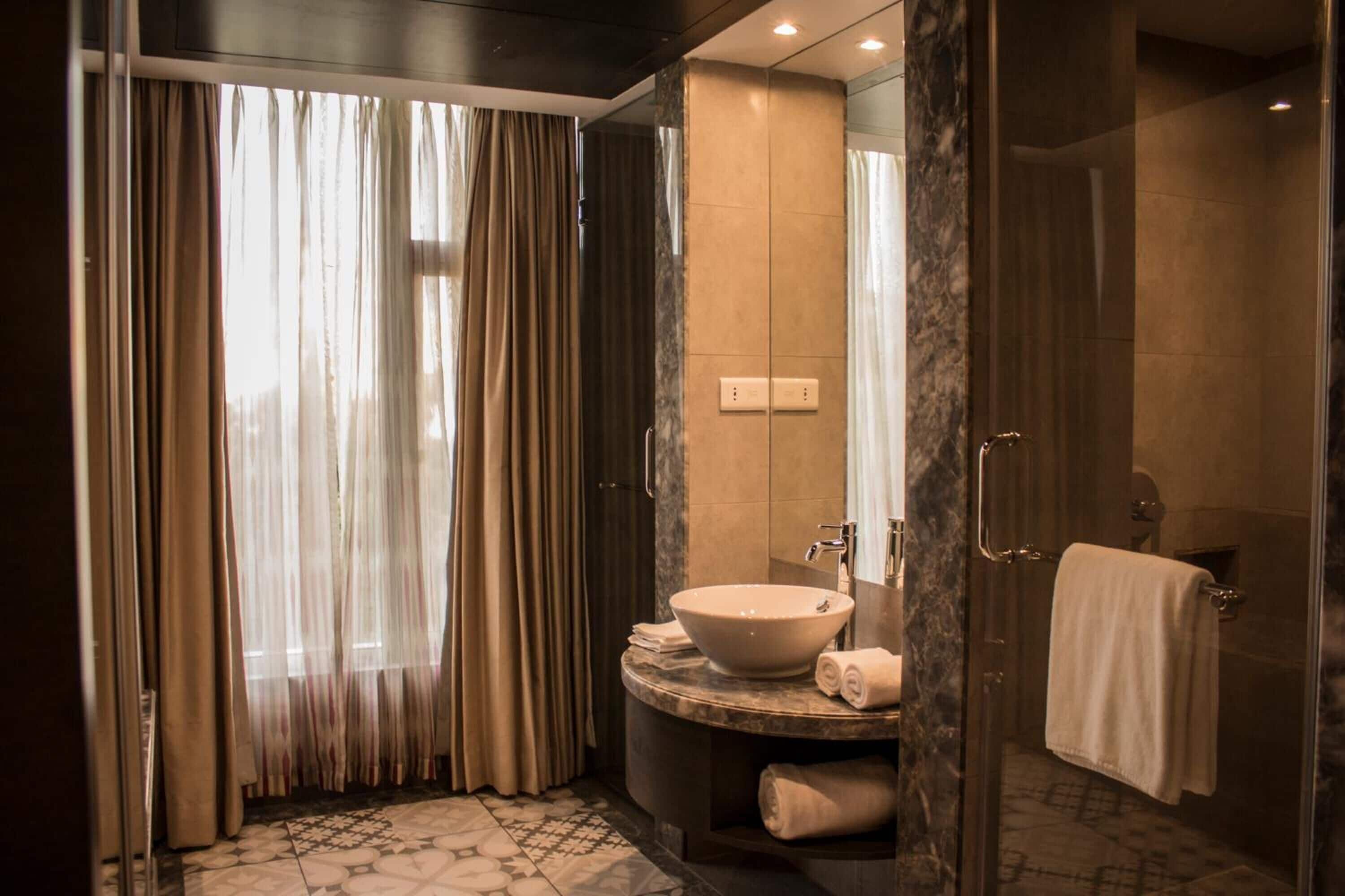 shower, free toiletries, slippers, towels