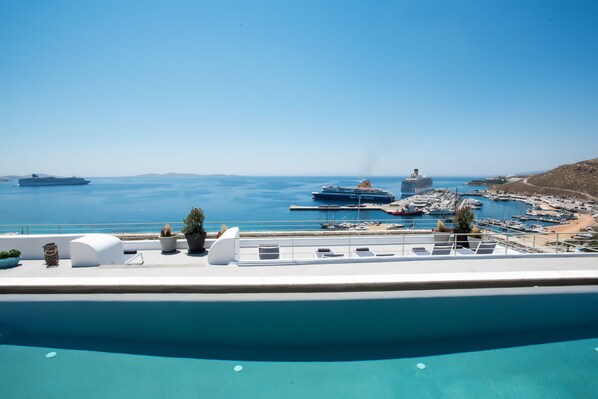 Outdoor pool, a rooftop pool, pool loungers