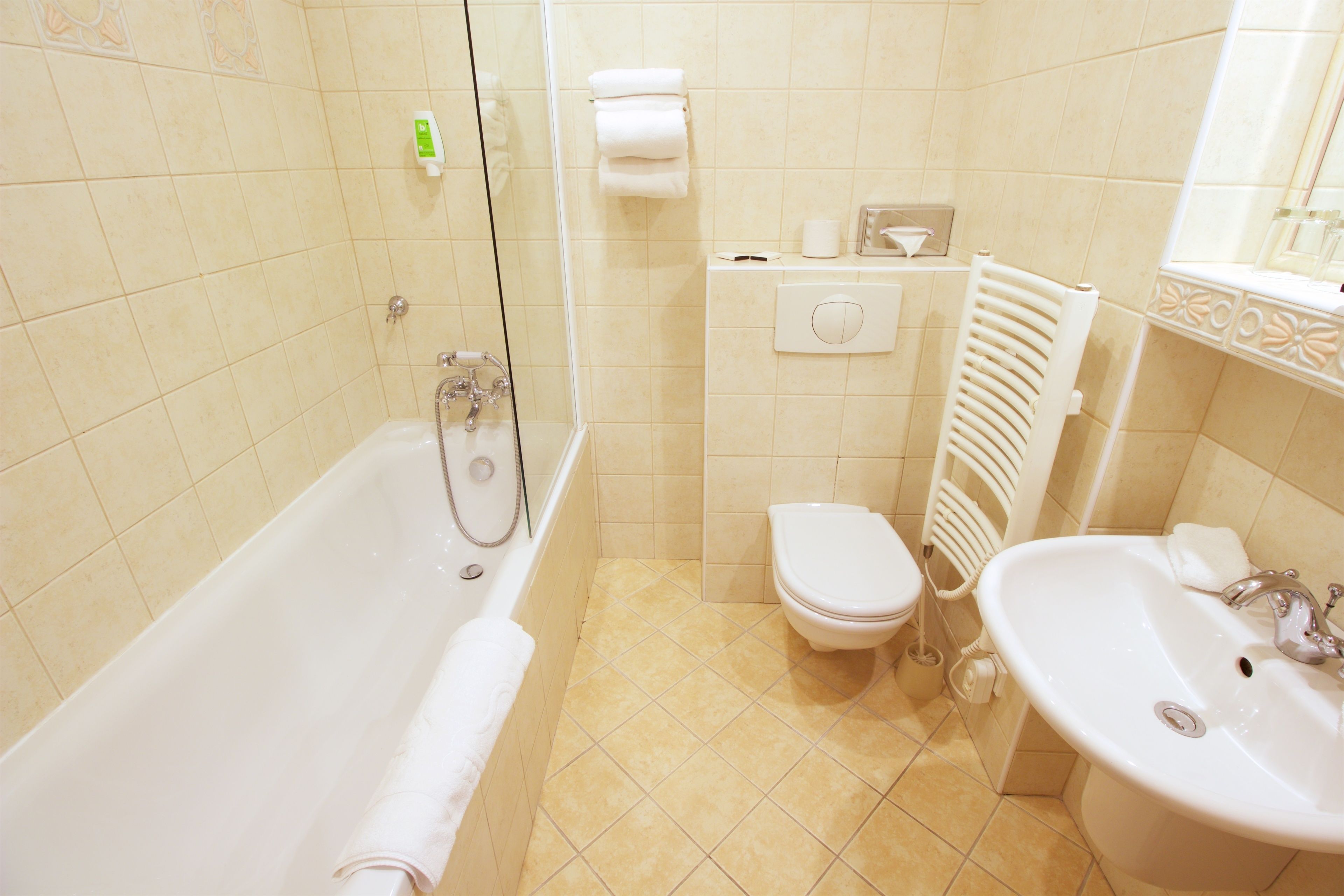 bathtub, free toiletries, hair dryer, towels