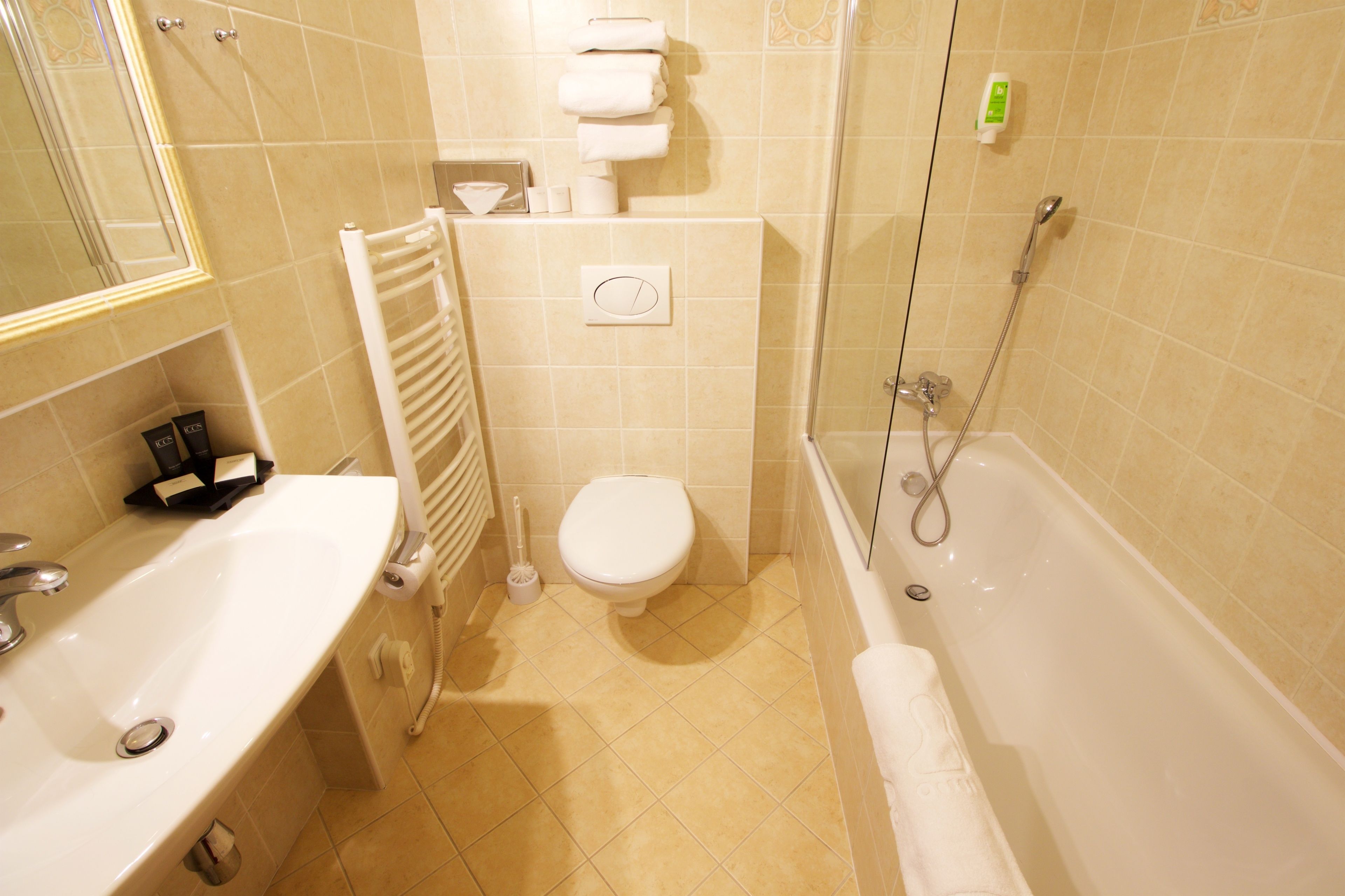 bathtub, free toiletries, hair dryer, towels