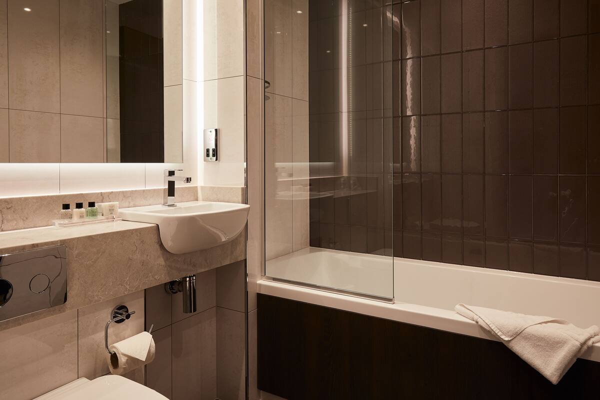 superior double room | bathroom | free toiletries, hair dryer, towels