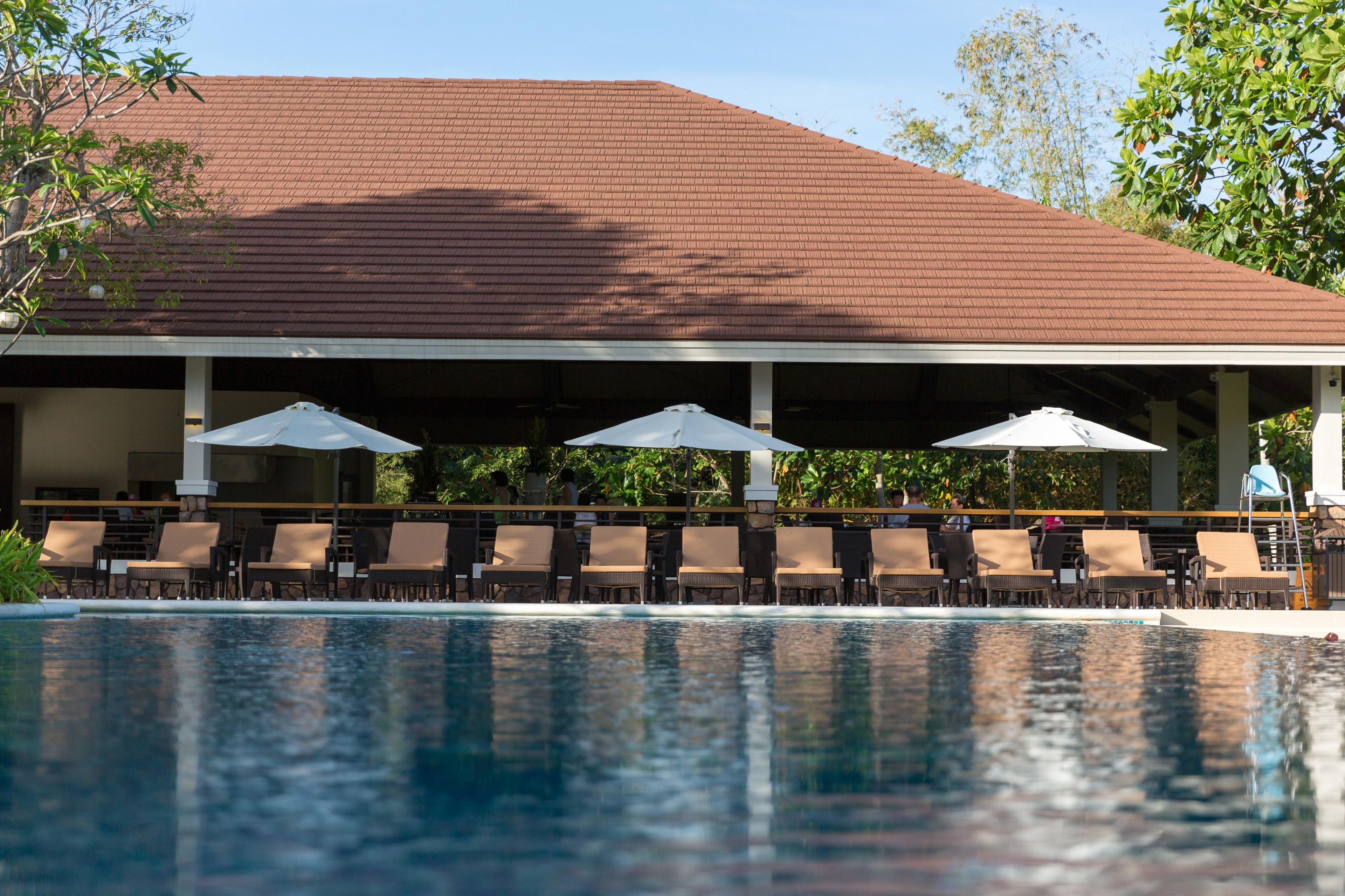 outdoor pool, open 6 am to 10:00 pm, pool umbrellas, pool loungers