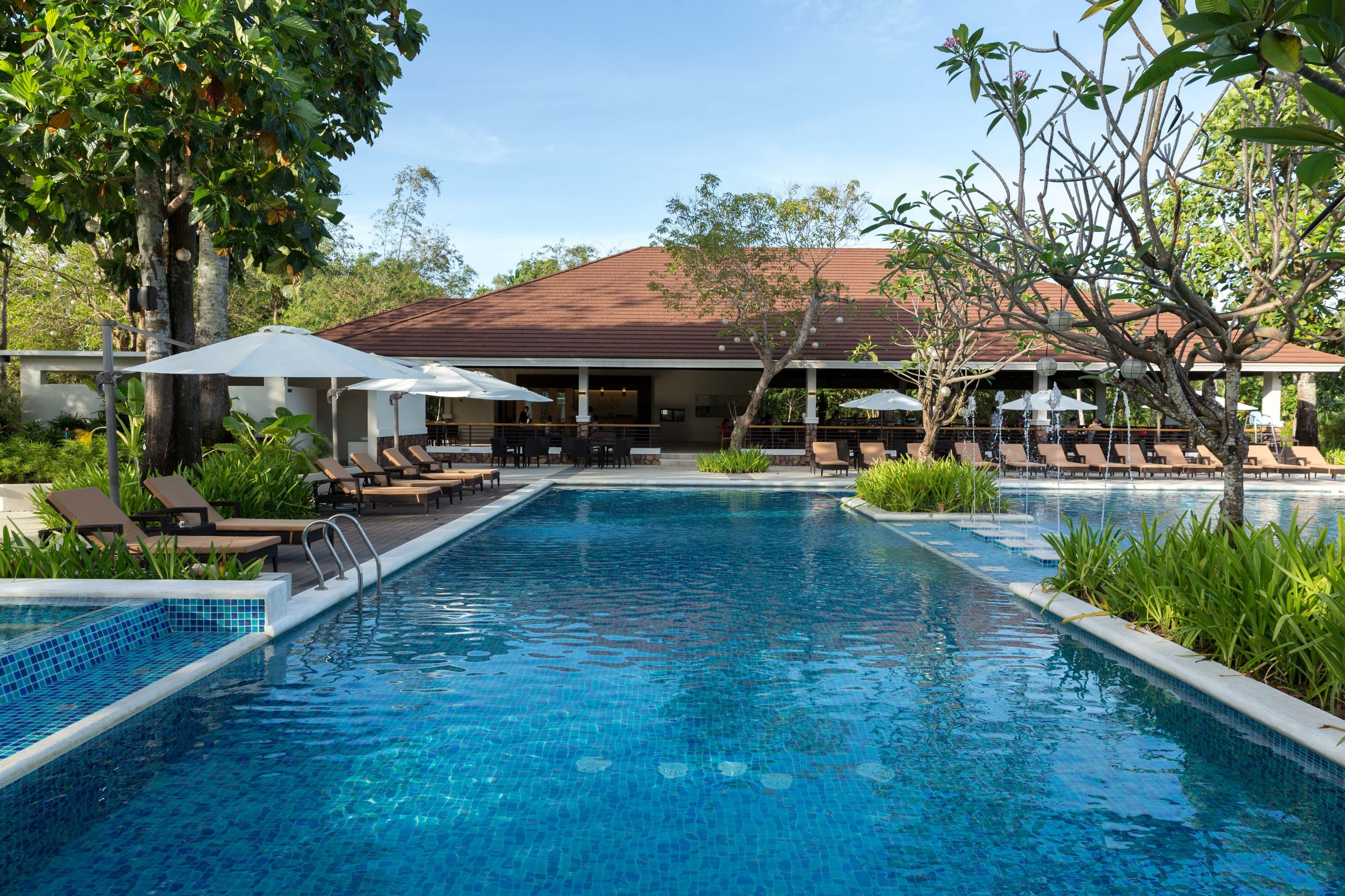 Outdoor pool, open 6 AM to 10:00 PM, pool umbrellas, pool loungers