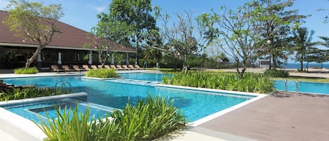 Outdoor pool, open 6 AM to 10:00 PM, pool umbrellas, sun loungers