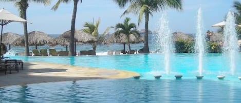 Outdoor pool, open 9 AM to 9 PM, pool umbrellas, pool loungers