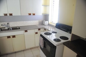 Apartment | Private kitchen | Fridge, microwave, oven, stovetop - Serenity Vacation Home (Montego Bay)