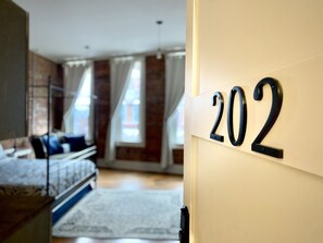 Premium bedding, memory-foam beds, laptop workspace, blackout curtains - Eighteen-Ninety Sleepover (Casey)