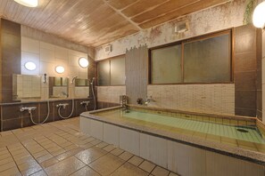 A public bath area with a large window, multiple mirrors, and a tiled floor. - Hotel Omiya (Kyoto)
