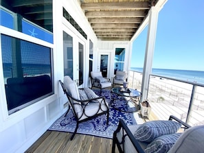 Relax in an outdoor space with ocean views and a seating area.