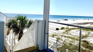 A balcony with a view of a beach and ocean. - Gulf front, North Cape, huge outdoor lounge, fenced pet area!!!! (Port St Joe)