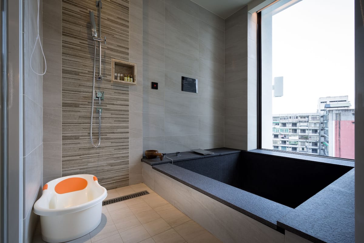 deluxe quadruple room | bathroom | separate bathtub and shower, spring water bathtub, free toiletries