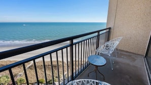 A balcony with a view of the beach and ocean. - Beachfront condo w/ ocean views & hot tub (North Myrtle Beach)