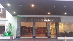 A hotel entrance with a marble facade and a sign above the doors. - Junikastay Blagoon Melaka (Malacca City)