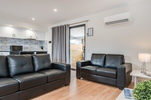Apartment, 2 Bedrooms | Living area | Flat-screen TV, DVD player