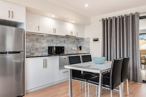 Apartment, 2 Bedrooms | Private kitchen | Full-sized fridge, microwave, oven, stovetop - Apartments on Fraser Bicheno (Bicheno)