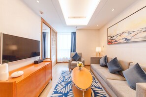 Deluxe Suite | Living room | TV, iPod dock