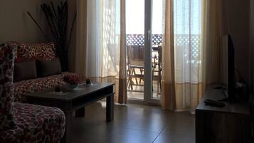 Apartment, Pool View | Living room | 32-inch LCD TV with satellite channels, TV