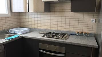 Apartment, Pool View | Private kitchen | Fridge, oven, coffee/tea maker, cookware/dishes/utensils