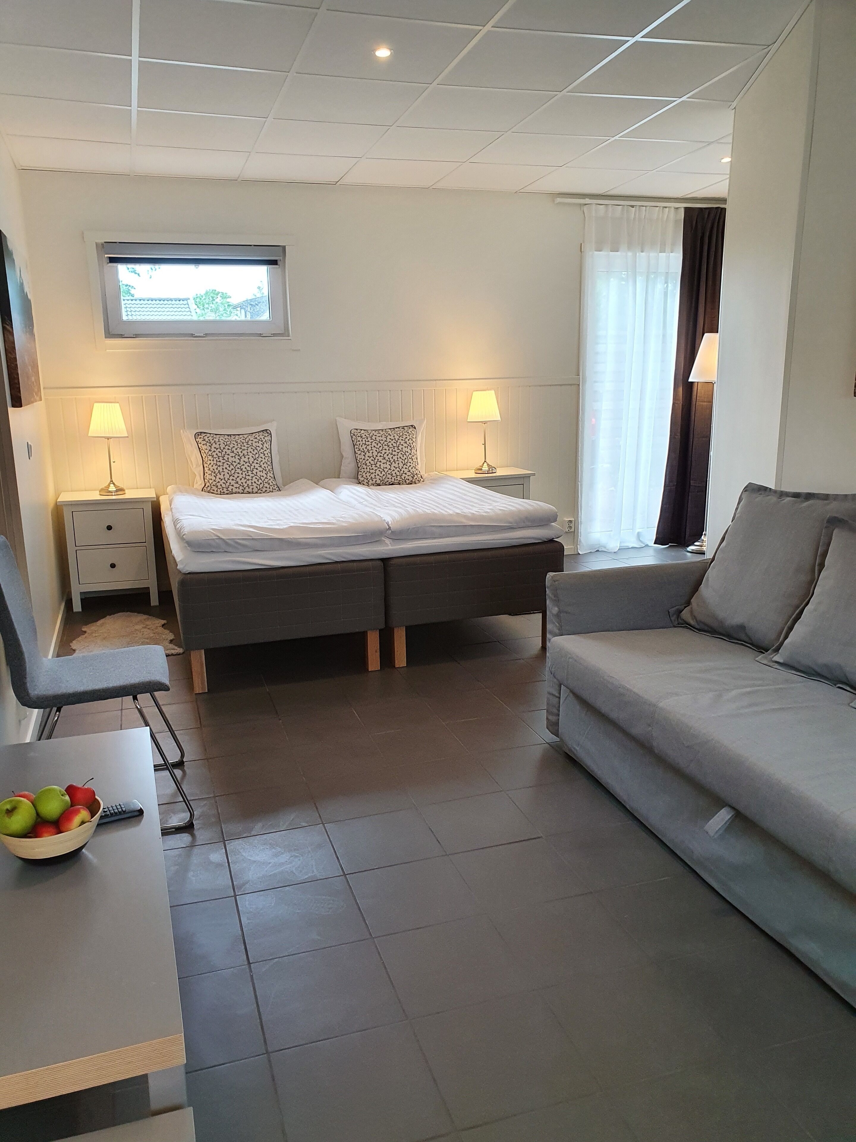 superior quadruple room, 1 bedroom | desk, laptop workspace, blackout curtains, iron/ironing board