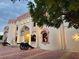 A building with traditional architecture, including arched windows and decorative elements.