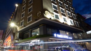 A multi-story hotel with a prominent sign for "Funda Hotel" on the ground floor. - Funda Hotel (Trabzon)