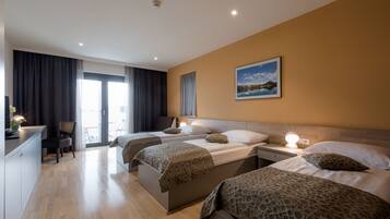 Triple Room, Balcony | Minibar, in-room safe, desk, blackout curtains