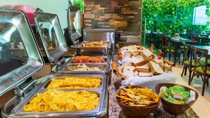 A buffet with various food options including scrambled eggs, French fries, and sandwiches. - Hotel Aixo Suites By Geh Suites (Cartagena)