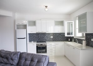 Apartment, 2 Bedrooms, Sea View | Private kitchen | Fridge, oven, stovetop, coffee/tea maker - Iridanos Apartments (Skiathos)