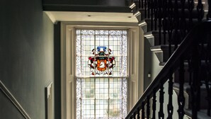 A stained glass window with a coat of arms design. - 15 Glasgow (Glasgow)