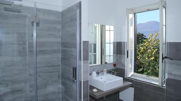Shower, rainfall showerhead, designer toiletries, hair dryer