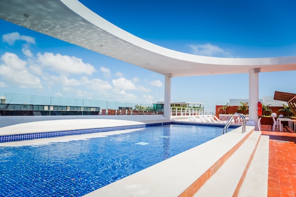 2 outdoor pools, open 10:00 AM to 10:00 PM, pool loungers
