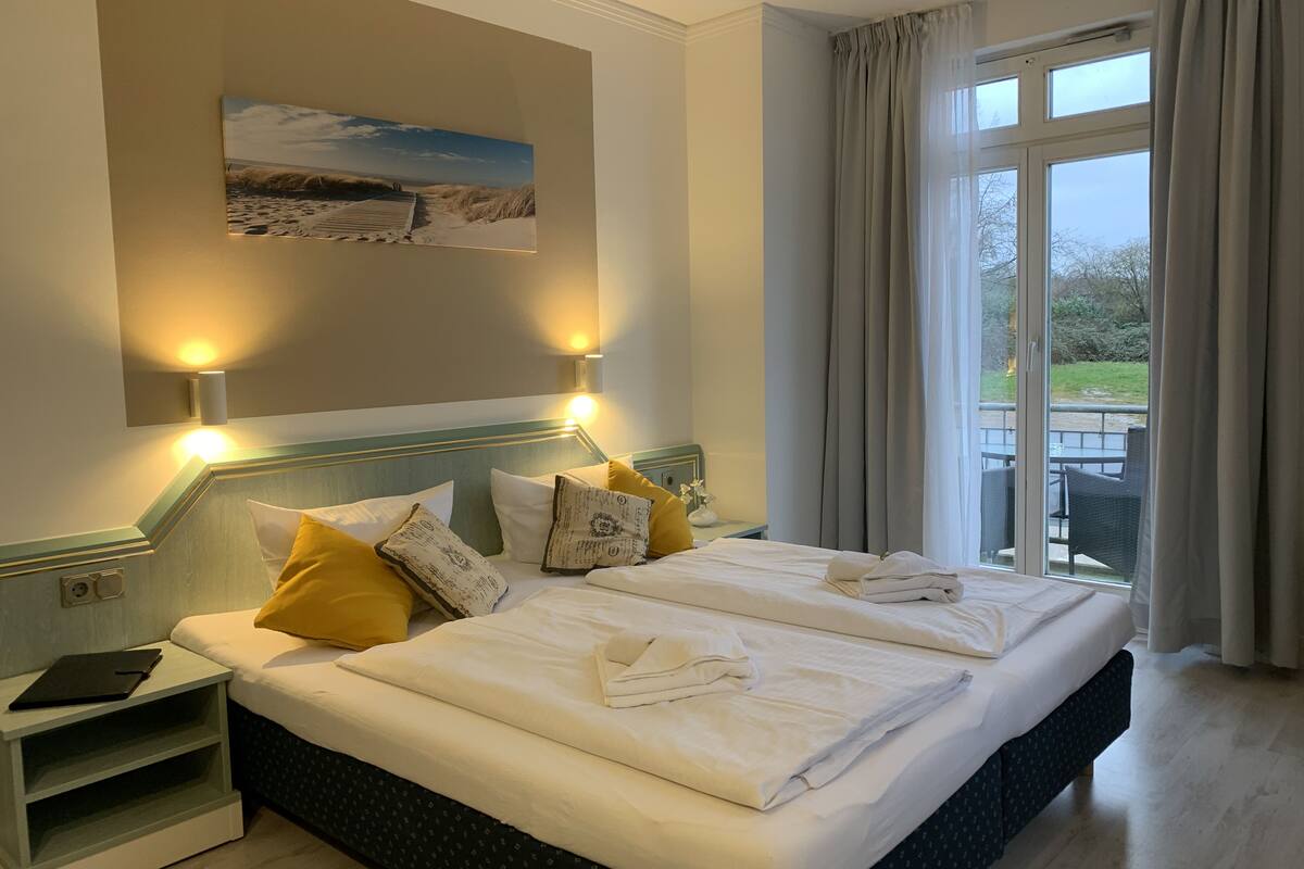 comfort double room, balcony, garden view | individually furnished, desk, free wifi, bed sheets