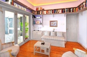 Room, 4 Bedrooms | Living area | Flat-screen TV