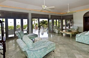 Room, 4 Bedrooms | Living area | Flat-screen TV