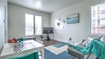 Premium Condo, 2 Bedrooms | Living room | 54-inch flat-screen TV with cable channels, TV, Netflix
