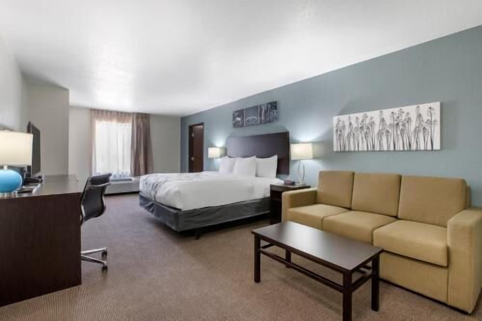Desk, iron/ironing board, bed sheets