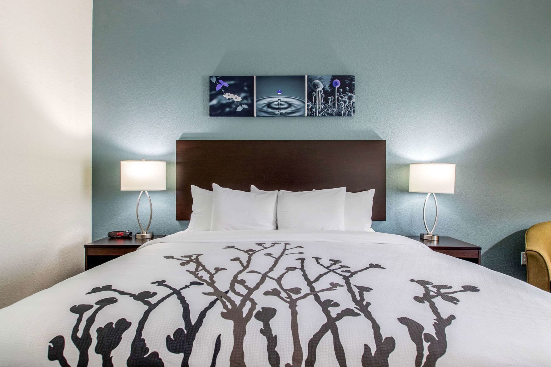 Desk, iron/ironing board, bed sheets