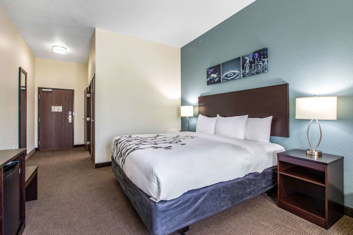 Desk, iron/ironing board, bed sheets