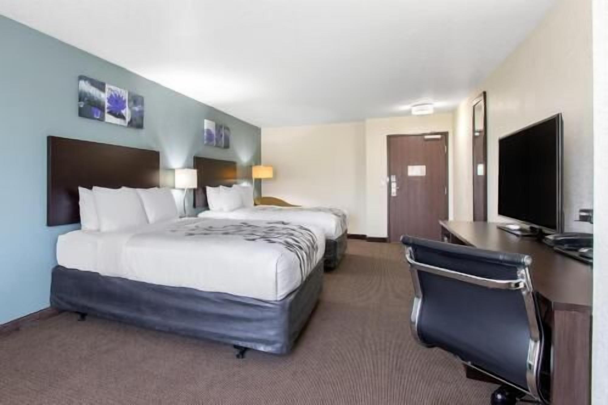Desk, iron/ironing board, bed sheets