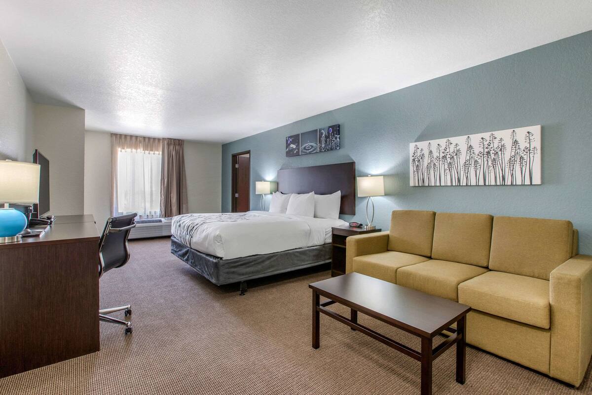 Desk, iron/ironing board, bed sheets