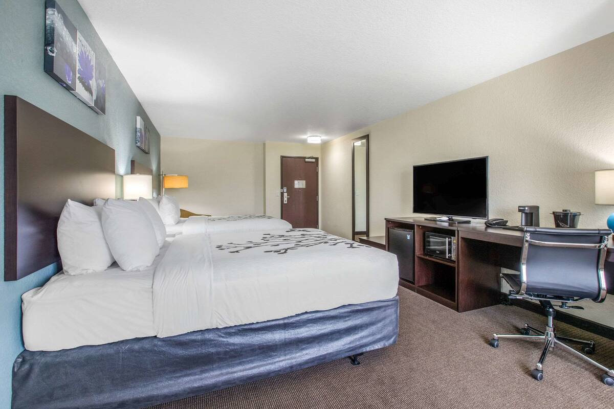 Desk, iron/ironing board, bed sheets
