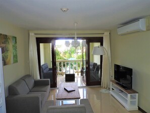 One Bedroom Apartment | Living area | Flat-screen TV