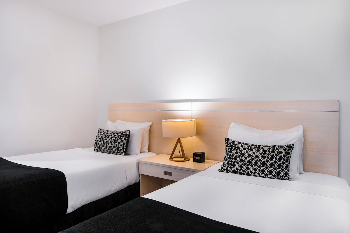 deluxe double room, multiple beds | select comfort beds, in-room safe, desk, blackout curtains