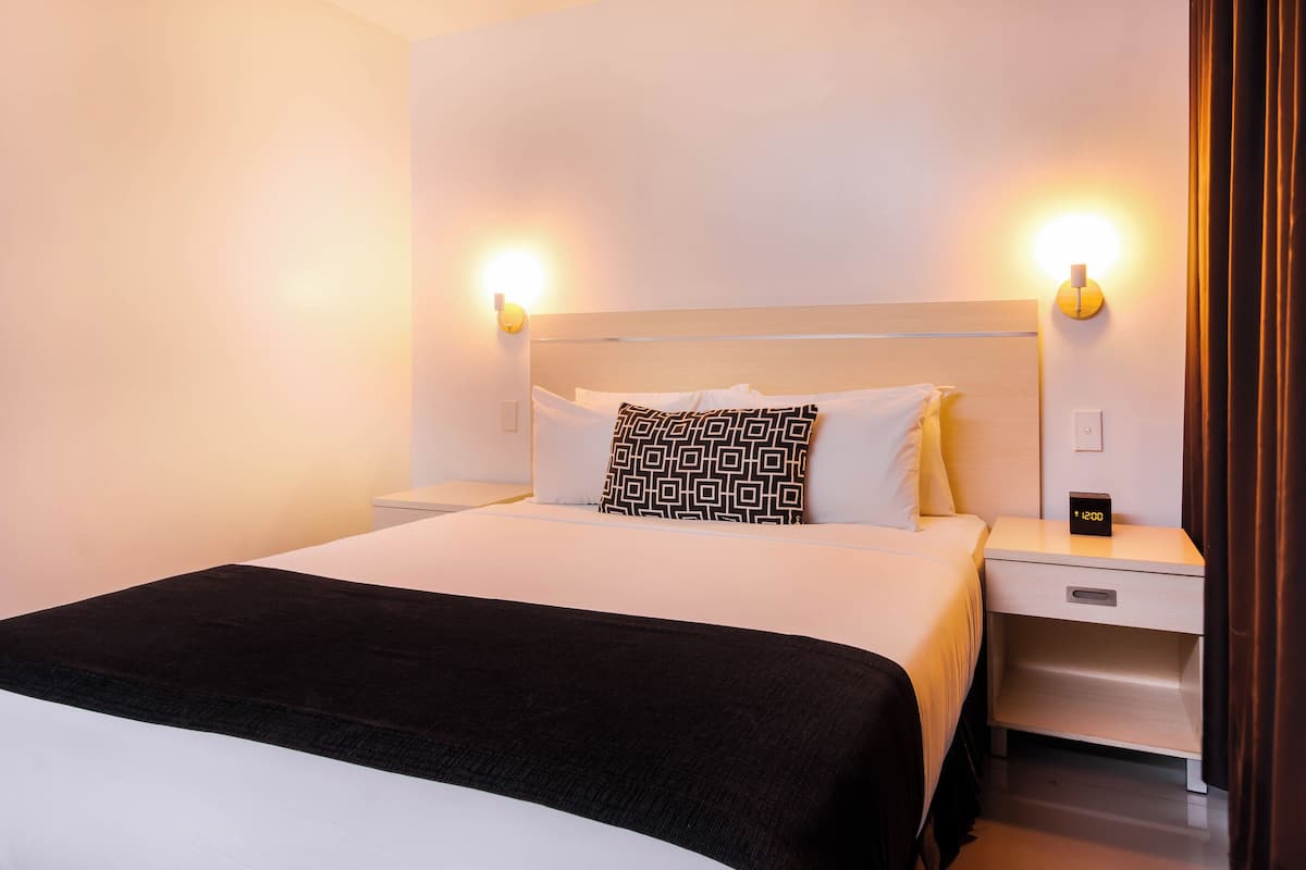 deluxe double room, 1 queen bed | select comfort beds, in-room safe, desk, blackout curtains
