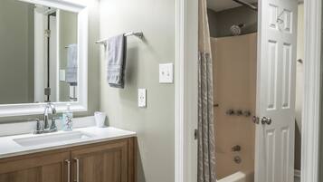 Combined shower/tub, hair dryer, towels, soap