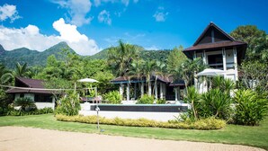A resort with multiple buildings, a swimming pool, and lush greenery. - Luxury villa, private beach, infinity pool. Fully serviced. Beautiful sunsets (koh chang)