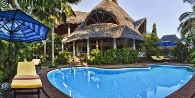 Large luxury beachside villa with a pool, guesthouse, cook, gardener, and maid