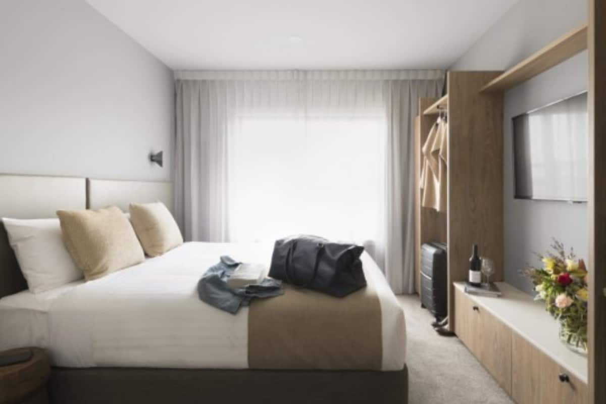 desk, laptop workspace, blackout curtains, iron/ironing board