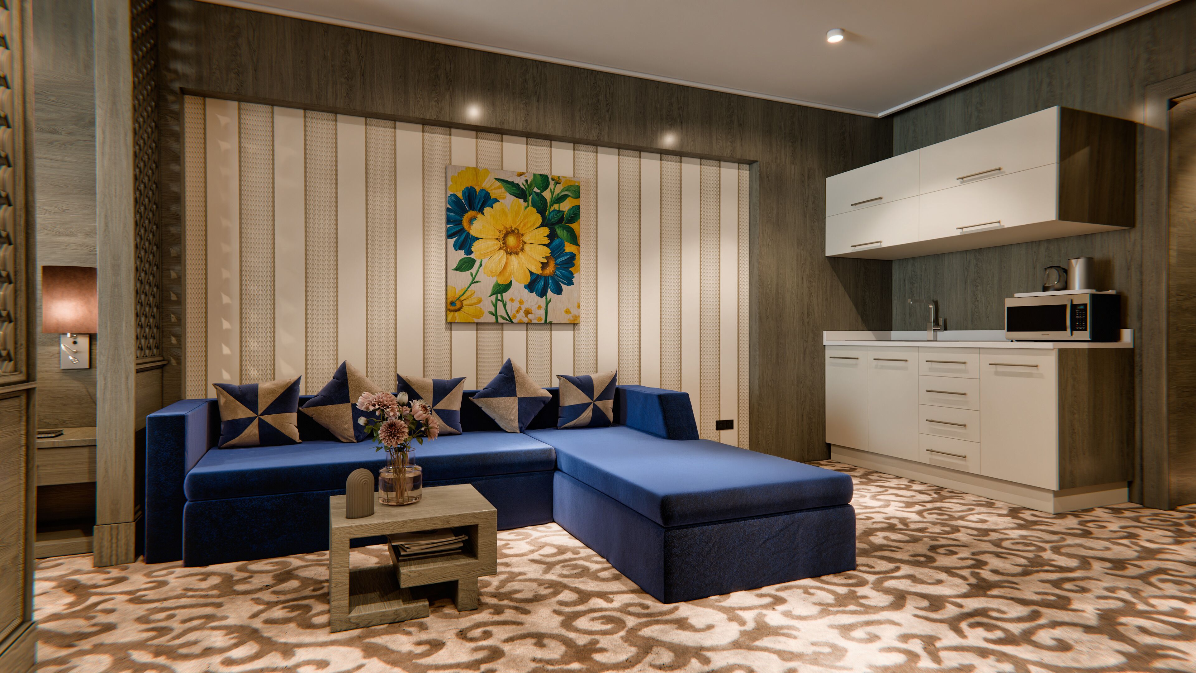 A modern living room with a sectional sofa, a coffee table, and a kitchen area with a microwave.
